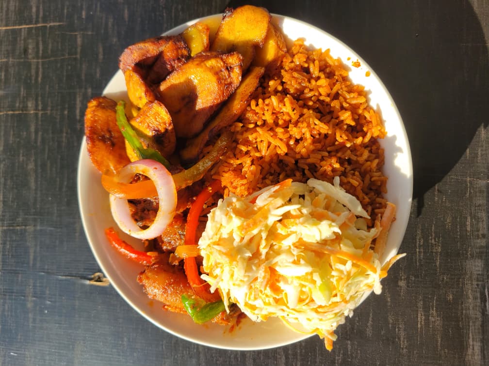 Nigerian jollof rice served with protein