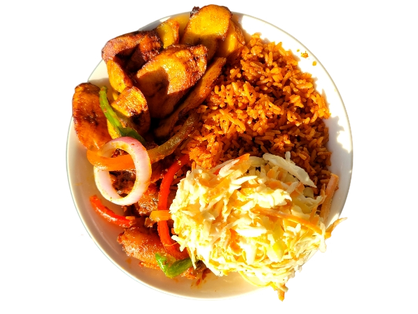 A Nigerian rice dish served with a glazed chicken drumstick